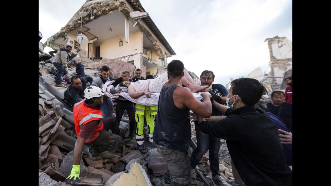 <strong>August 24:</strong> A rescued woman is carried away on a stretcher after <a href="http://www.cnn.com/2016/08/25/europe/italy-earthquake/" target="_blank">a 6.2-magnitude earthquake</a> in Amatrice, Italy. The earthquake devastated towns across central Italy and killed more than 250 people.