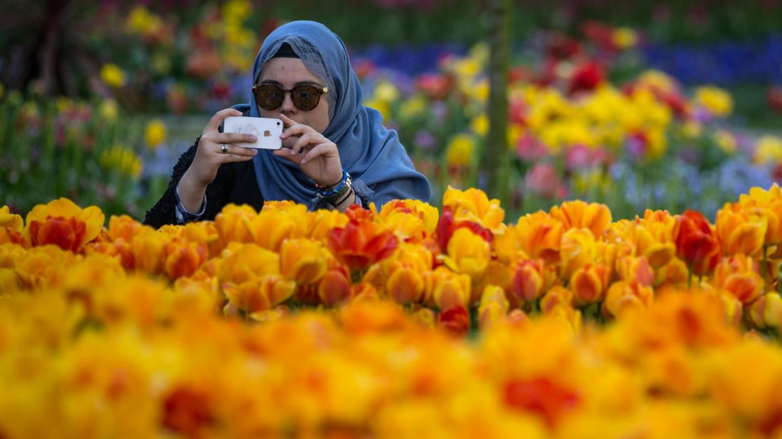 Istanbul, Turkey was in at #9 -- and may have also played a part in #turkey being named the year's most popular food hashtag. A woman snaps a picture during the city's annual Tulip Festival, held in April. 