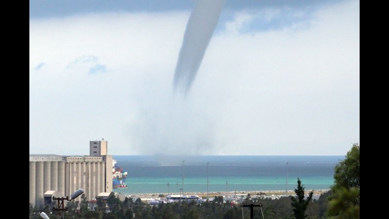 <strong>September 23:</strong> A waterspout passes near a beach in Turkey's Hatay Province.