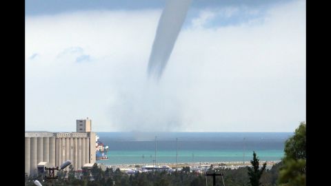 <strong>September 23:</strong> A waterspout passes near a beach in Turkey's Hatay Province.