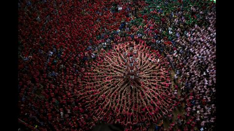 <strong>October 2:</strong> People form a human tower during an annual competition in Tarragona, Spain.