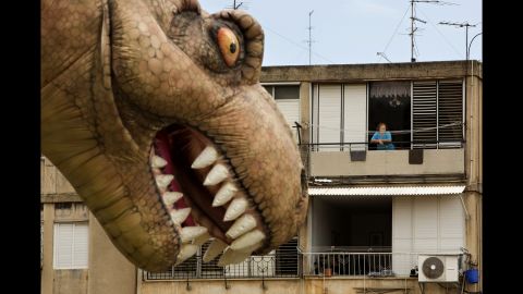 <strong>March 24:</strong> A dinosaur balloon floats through Petah Tikva, Israel, during a parade for the Jewish holiday of Purim.