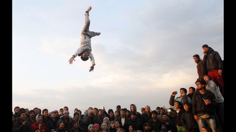 <strong>March 27:</strong> Migrants gather for a party at the border station of Idomeni, Greece.