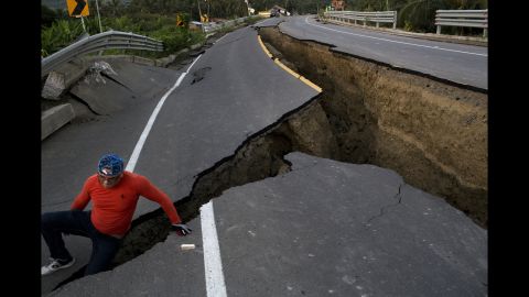 <strong>April 19:</strong> A man in Chacras, Ecuador, investigates a road that collapsed after <a href="http://www.cnn.com/2016/04/20/americas/ecuador-earthquake/" target="_blank">a 7.8-magnitude earthquake.</a> It was the strongest earthquake to hit Ecuador in decades. Hundreds of people were killed.