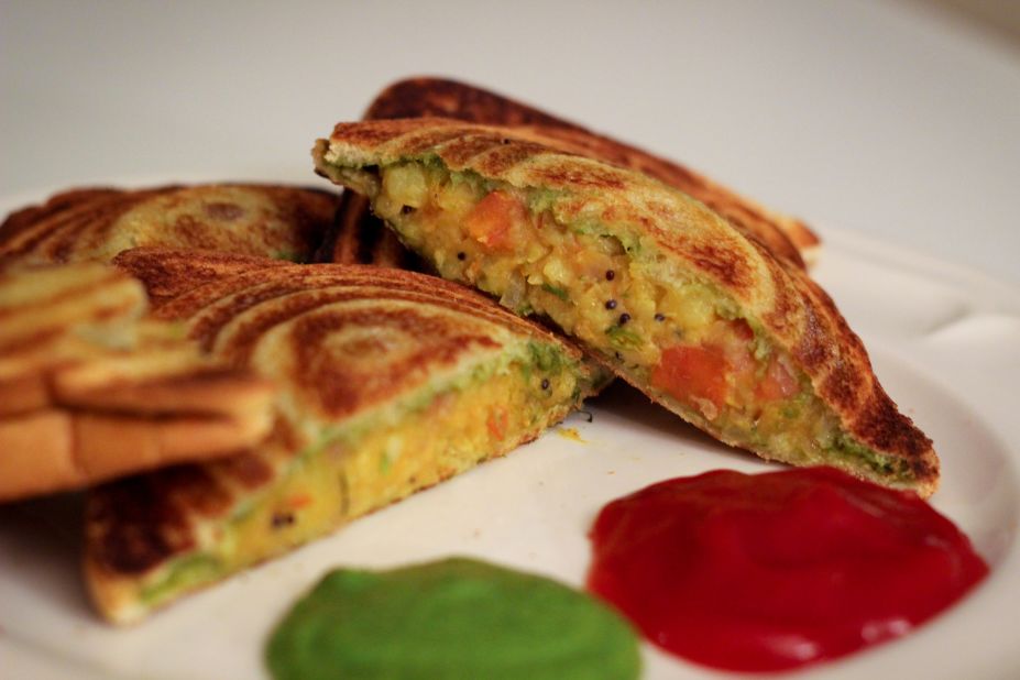 This Mumbai classic features a generous smearing of green chutney, fresh veggies and  (sometimes) crumbled cottage cheese. It's grilled to golden perfection on a small hand-held toaster.