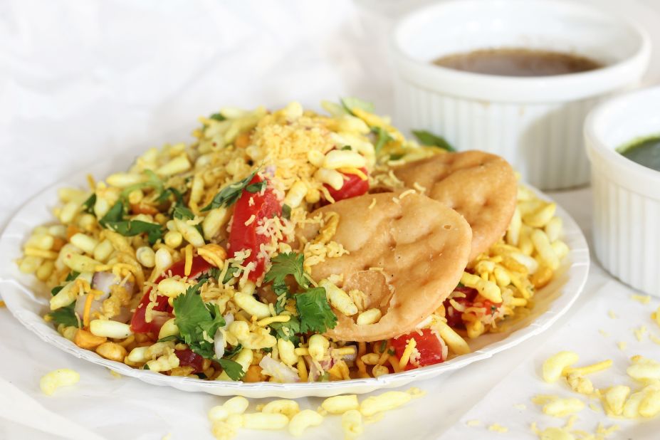 Versions of this popular dish can be found throughout India. Mumbai's rendition is made of puffed rice, sev (a thin and crisp fried snack made of chickpea flour), boiled potato, raw mango and onions. It's topped with fresh coriander and two or three chutneys. 