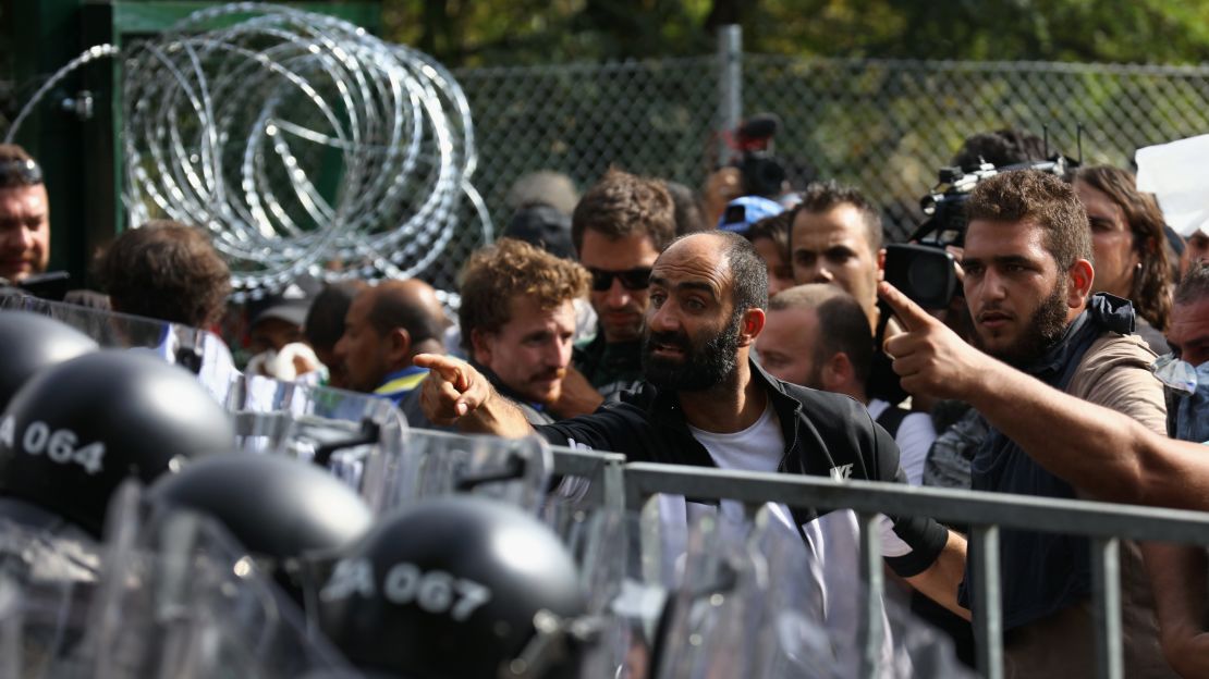 Ahmed H. speaking to riot police from behind a blockade on September 16, 2015.