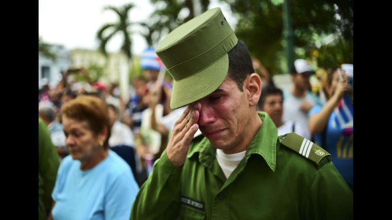 A soldier reacts after the ashes of longtime Cuban leader Fidel Castro passed through Santa Clara, Cuba, on Thursday, December 1. 