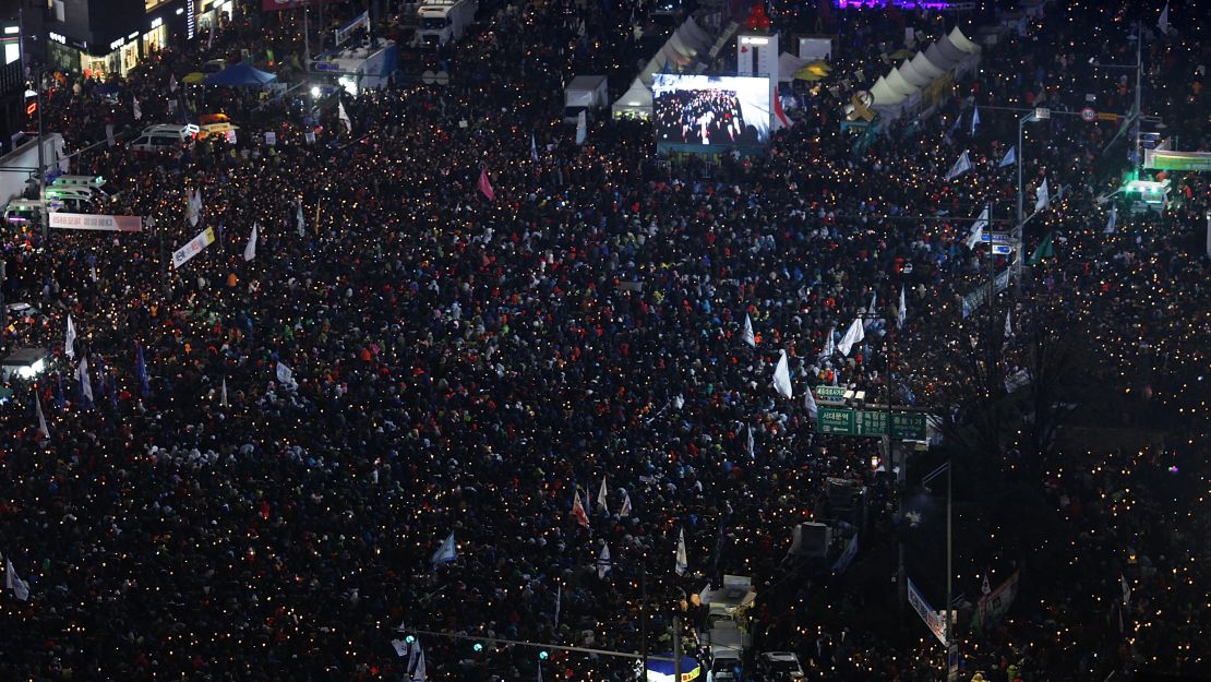 Hundreds of thousands took to the streets of Seoul to protest Park.