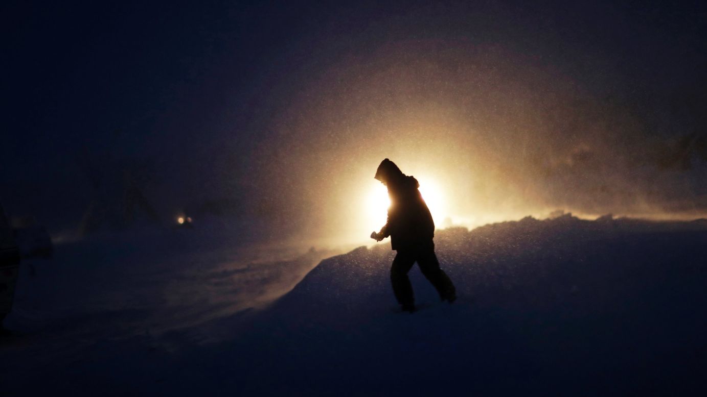 A person walks through snow and wind on Tuesday, November 29.