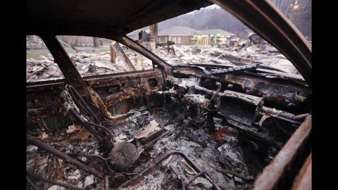 <strong>November 30:</strong> A burned car sits in a parking lot after a wildfire swept through Gatlinburg, Tennessee. Gatlinburg city officials declared mandatory evacuations in several areas as firefighters <a href="http://www.cnn.com/2016/11/28/us/southern-fires-gatlinburg-smokies/index.html" target="_blank">battled at least 14 fires in and around the city.</a>