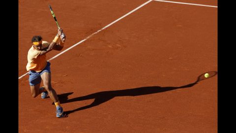 Rafael Nadal returns a ball during the Barcelona Open final, which he won Sunday, April 24, in Barcelona, Spain. It was Nadal's 49th clay-court title, <a href="http://www.cnn.com/2016/04/24/tennis/tennis-barcelona-nadal-nishikori-vilas/index.html" target="_blank">tying the record</a> set by Guillermo Vilas.