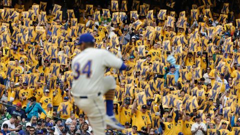 Fans of the Seattle Mariners hold up signs for pitcher Felix Hernandez as he winds up for a pitch on Sunday, April 10. The "K" stands for strikeout in baseball terminology.