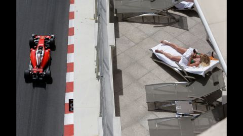 A woman sunbathes during a Formula One practice session in Monaco on Thursday, May 26.
