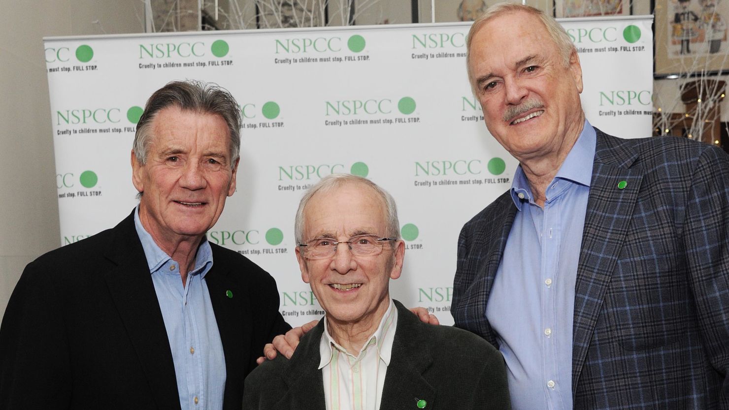 Michael Palin, Andrew Sachs, center, and John Cleese attend an event in London November 24, 2013.