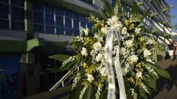 People pay tribute to the players of Brazilian team Chapecoense Real who were killed in a plane accident in the Colombian mountains, at the club's Arena Conda stadium in Chapeco, in the southern Brazilian state of Santa Catarina, on December 1, 2016. 
Players of the Chapecoense were among 81 people on board the doomed flight that crashed into mountains in northwestern Colombia, in which officials said just six people were thought to have survived, including three of the players. Chapecoense had risen from obscurity to make it to the Copa Sudamericana finals scheduled for Wednesday against Atletico Nacional of Colombia. / AFP / DOUGLAS MAGNO        (Photo credit should read DOUGLAS MAGNO/AFP/Getty Images)