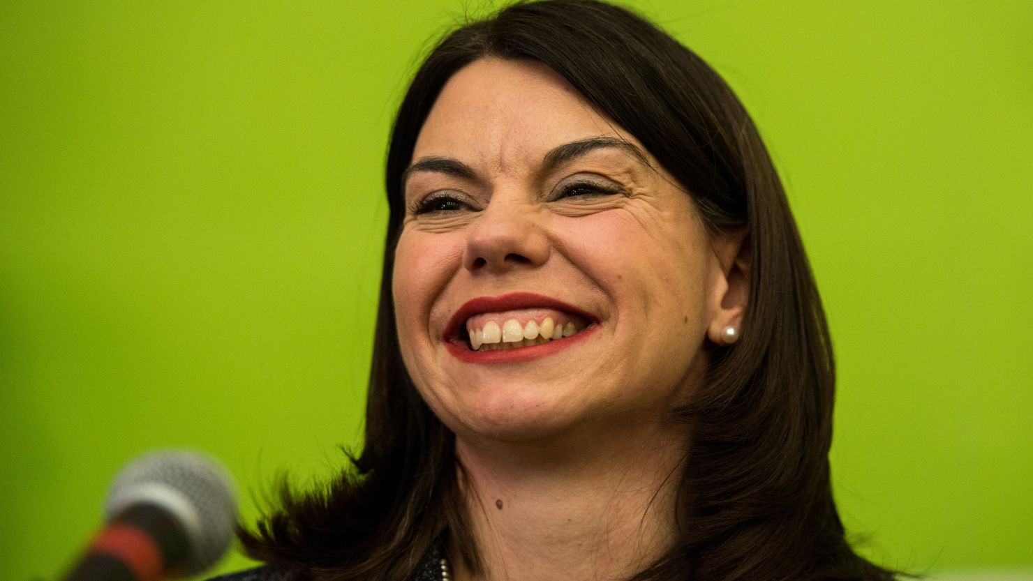 Liberal Democrat candidate Sarah Olney speaks onstage after winning the Richmond Park by-election in London.
