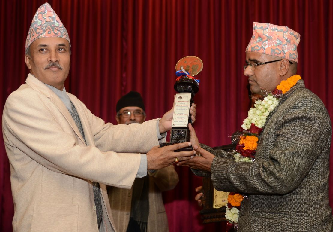 Nepalese civil servant Gyan Mani Nepal receives the inaugural Integrity Idol trophy for 2014.