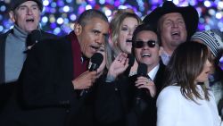 WASHINGTON, DC - DECEMBER 01: U.S. President Barack Obama sings Jingle Bells with Marc Anthony (C), James Taylor (L), Trisha Yearwood, Garth Brooks (R) and Eva Longoria (R, foreground) during the National Christmas Tree lighting ceremony, on December 1, 2016 in Washington, DC. This year is the 94th annual National Christmas Tree Lighting Ceremony.  (Photo by Mark Wilson/Getty Images)