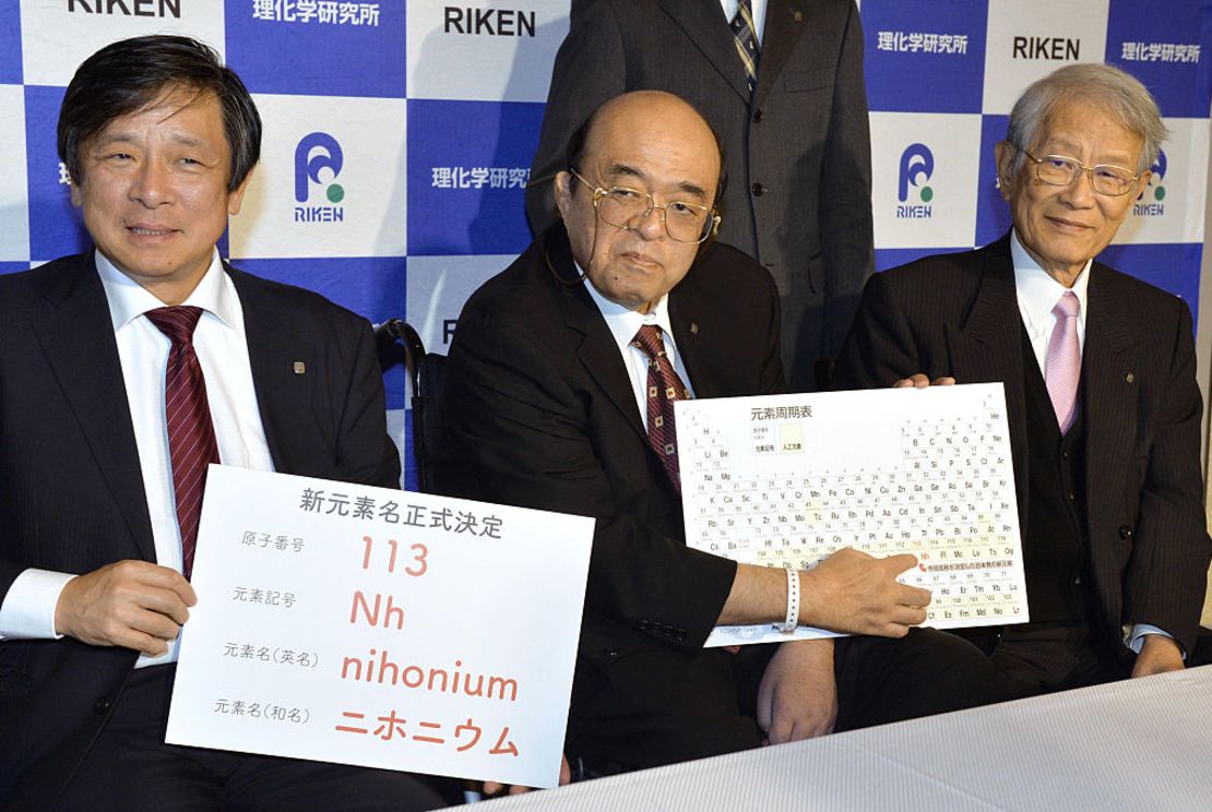 Kyushu University Professor Kosuke Morita (C) points to the "nihonium" on a periodic table during a press conference in the southwestern Japan city of Fukuoka on Dec. 1, 2016.