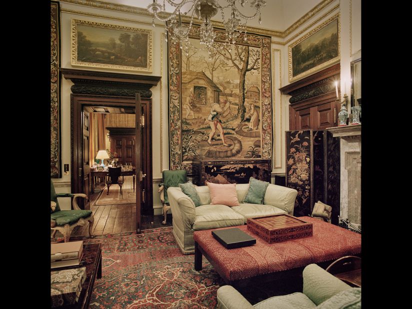 This tapestry-lined private sitting room is in Houghton Hall, a home built by Britain's first prime minister, Sir Robert Walpole, in 1722 in Norfolk. It once housed what was considered to be one of the finest collections of art in Britain until hundreds of the pieces were sold to Catherine the Great by the financially troubled heirs of the state. Houghton Hall's current owner and descendent of Walpole, David George Philip Cholmondeley the 7th Marquess of Cholmondeley, was able to secure a temporary return of 70 of the pictures, which hung in their original locations for six months.