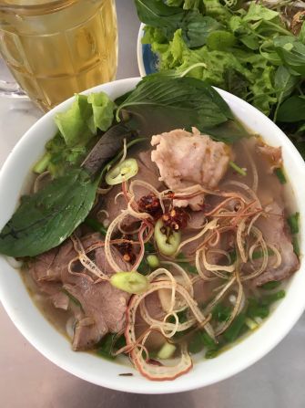 Bun bo Hue is a noodle soup that originated in the former imperial capital of Hue. It's made of vermicelli, generous slices of beef shank and a lemon grass and shrimp-based broth 