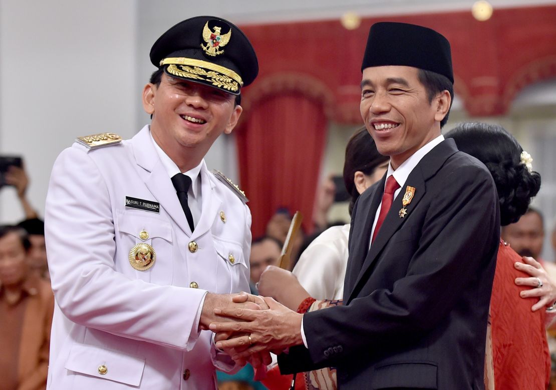 Indonesian President Joko Widodo with Ahok after the latter's swearing in as governor on November 19, 2014.