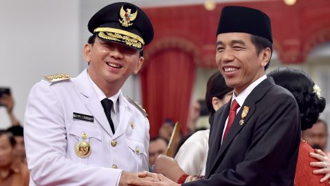 Indonesian President Joko Widodo, right, congratulates  the Jakarta governor at his swearing-in in 2014.