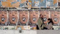 People walk past poster of far-right political movement CasaPound which call to vote "No" at the constitutional referendum, on November 30, 2016 in Rome. Italy holds a referendum on December 4, 2016 on proposed constitutional reforms that are considered the most important in the eurozone country since World War II.  / AFP / FILIPPO MONTEFORTE        (Photo credit should read FILIPPO MONTEFORTE/AFP/Getty Images)
