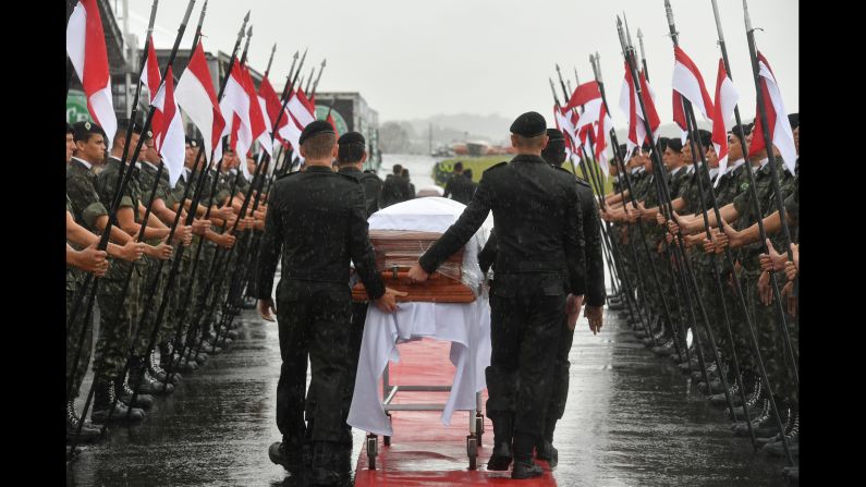A military guard of honor receives the coffins of members of the <a href="index.php?page=&url=http%3A%2F%2Fwww.cnn.com%2F2016%2F11%2F29%2Ffootball%2Fbrazil-chapecoense-plane-crash%2Findex.html">Chapecoense soccer team</a> who were killed in a plane crash as they arrive at the airport in Chapeco, Brazil, on Saturday, December 3. The football club was traveling to compete in the Copa Sudamericana final when <a href="index.php?page=&url=http%3A%2F%2Fwww.cnn.com%2F2016%2F11%2F29%2Famericas%2Fcolombia-plane-accident%2Findex.html">its charter plane crashed near Medellin, Colombia</a>, on Monday, November 28, killing 71 people on board. Six people survived, including three Chapecoense players.