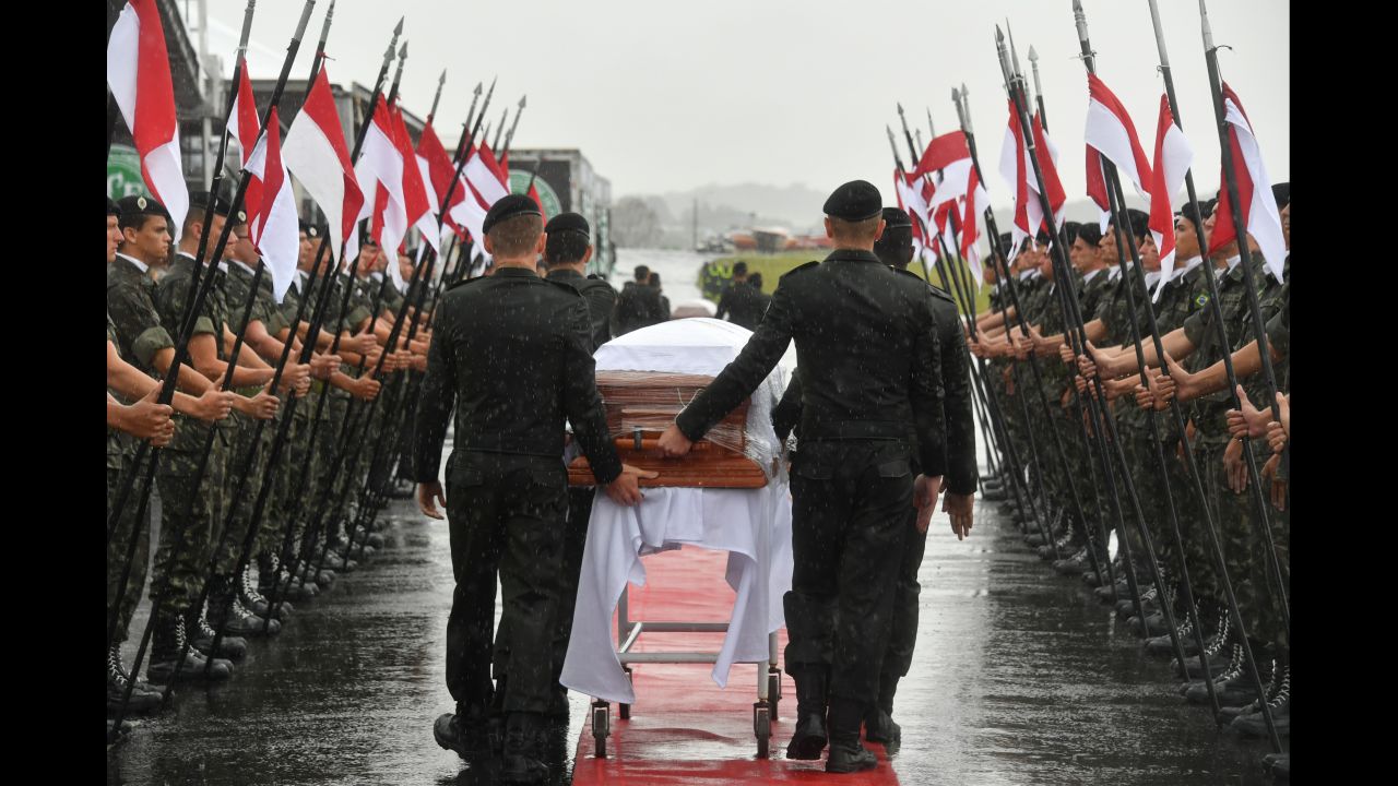 A military guard of honor receives the coffins of members of the <a href="http://www.cnn.com/2016/11/29/football/brazil-chapecoense-plane-crash/index.html">Chapecoense soccer team</a> who were killed in a plane crash as they arrive at the airport in Chapeco, Brazil, on Saturday, December 3. The football club was traveling to compete in the Copa Sudamericana final when <a href="http://www.cnn.com/2016/11/29/americas/colombia-plane-accident/index.html">its charter plane crashed near Medellin, Colombia</a>, on Monday, November 28, killing 71 people on board. Six people survived, including three Chapecoense players.