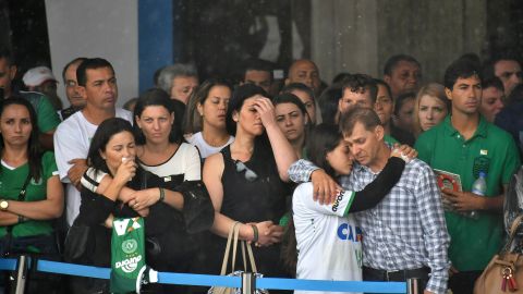 Relatives of the players wait for the arrival of the bodies at the Chapeco Airport on December 3. 