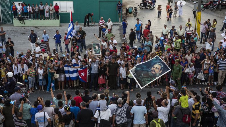 Cubans see the ashes of Fidel Castro being carried by a special convoy through the city of Holguin on Saturday, December 3. 