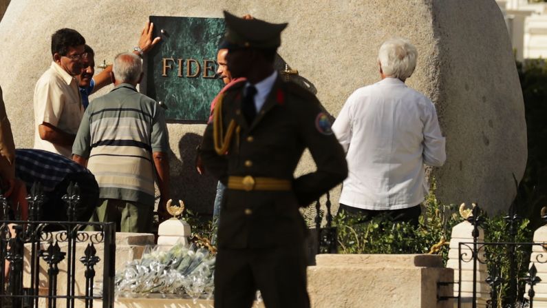 Workers place a plaque with the word "Fidel" on the tomb holding the remains of former Cuban President Fidel Castro in the Cementerio Santa Ifigenia where he was buried, Sunday, December 4, in Santiago de Cuba. Cubans <a href="http://www.cnn.com/2016/11/27/world/fidel-castro-funeral-reaction/" target="_blank">are honoring his life</a> this week.