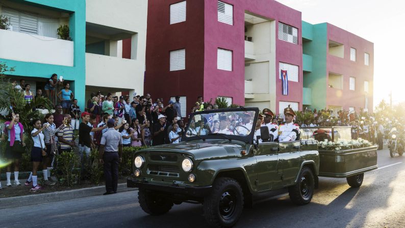 Fidel Castro's ashes pass on the streets going to the cemetery in Santiago de Cuba on December 4. 