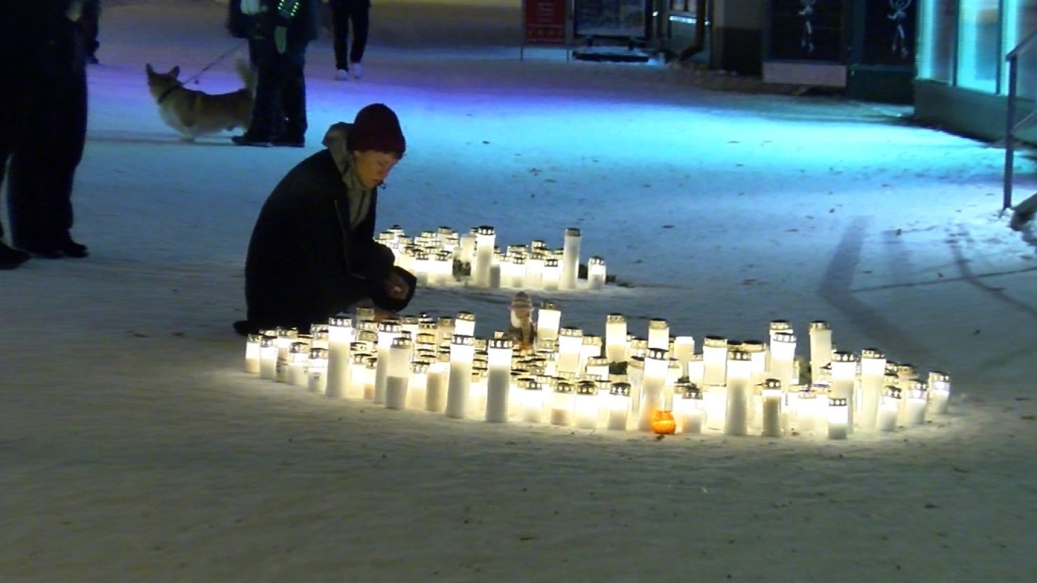 A candlelight vigil at the scene of the shooting.