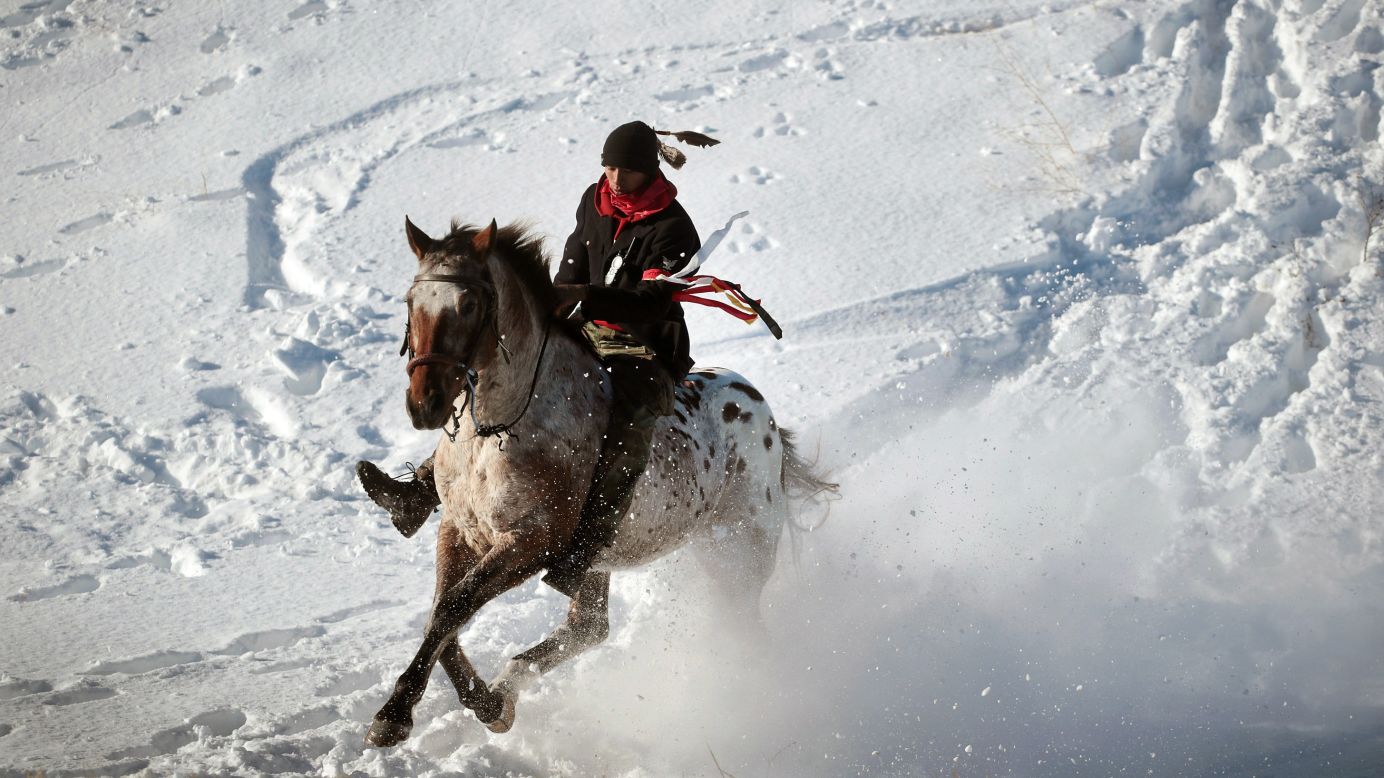 An activist rides down from a ridge on the edge of the Standing Rock Sioux Reservation on December 4.