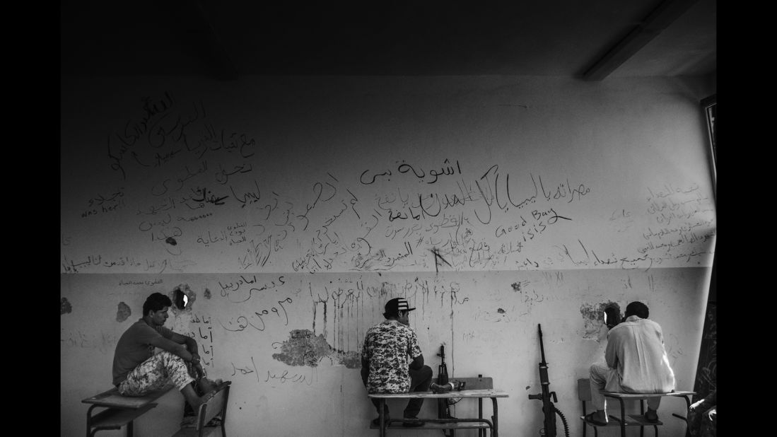 Libyan fighters hold a defensive position inside a school.