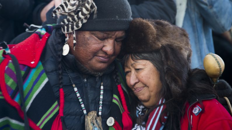 Activists embrace after the December halt of the <a href="index.php?page=&url=http%3A%2F%2Fwww.cnn.com%2F2016%2F09%2F07%2Fus%2Fdakota-access-pipeline-visual-guide%2F" target="_blank">Dakota Access Pipeline</a> route. The $3.7 billion project that would cross four states and change the landscape of the US crude oil supply. The Standing Rock Sioux tribe says the pipeline would affect its drinking-water supply and destroy its sacred sites.