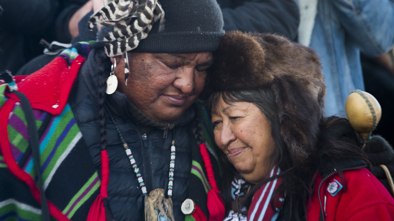 Activists embrace after the December halt of the <a href="http://www.cnn.com/2016/09/07/us/dakota-access-pipeline-visual-guide/" target="_blank">Dakota Access Pipeline</a> route. The $3.7 billion project that would cross four states and change the landscape of the US crude oil supply. The Standing Rock Sioux tribe says the pipeline would affect its drinking-water supply and destroy its sacred sites.