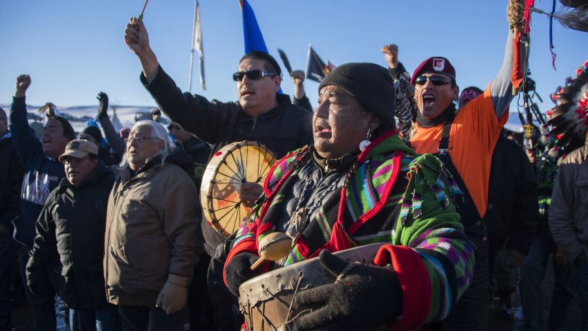 Activists celebrate at Oceti Sakowin Camp on the edge of the Standing Rock Sioux Reservation on December 4, 2016 outside Cannon Ball, North Dakota. The Army Corps of Engineers on Sunday notified the Standing Rock Sioux that the current route for the Dakota Access pipeline will be denied. / AFP / JIM WATSON        (Photo credit should read JIM WATSON/AFP/Getty Images)