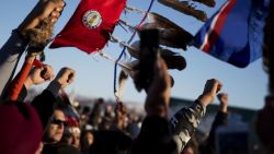 A crowd celebrates at the Oceti Sakowin camp after it was announced that the U.S. Army Corps of Engineers won't grant easement for the Dakota Access oil pipeline in Cannon Ball, N.D., Sunday, Dec. 4, 2016. (AP Photo/David Goldman)