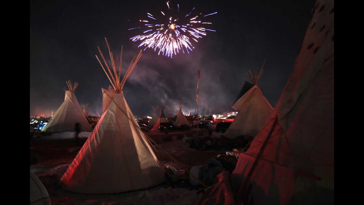 Fireworks lit the sky at the Oceti Sakowin Camp  near Cannon Ball, North Dakota on December 4, 2016, after the Army Corps of Engineers halted the Dakota Access Pipeline route. An executive order by President Donald Trump in January allowed work to resume. 