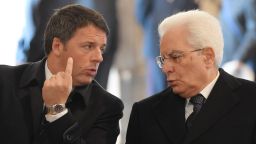 Italy's President Sergio Mattarella (right) speaks with then-Prime Minister Matteo Renzi during a 2016 ceremony at the Vatican.