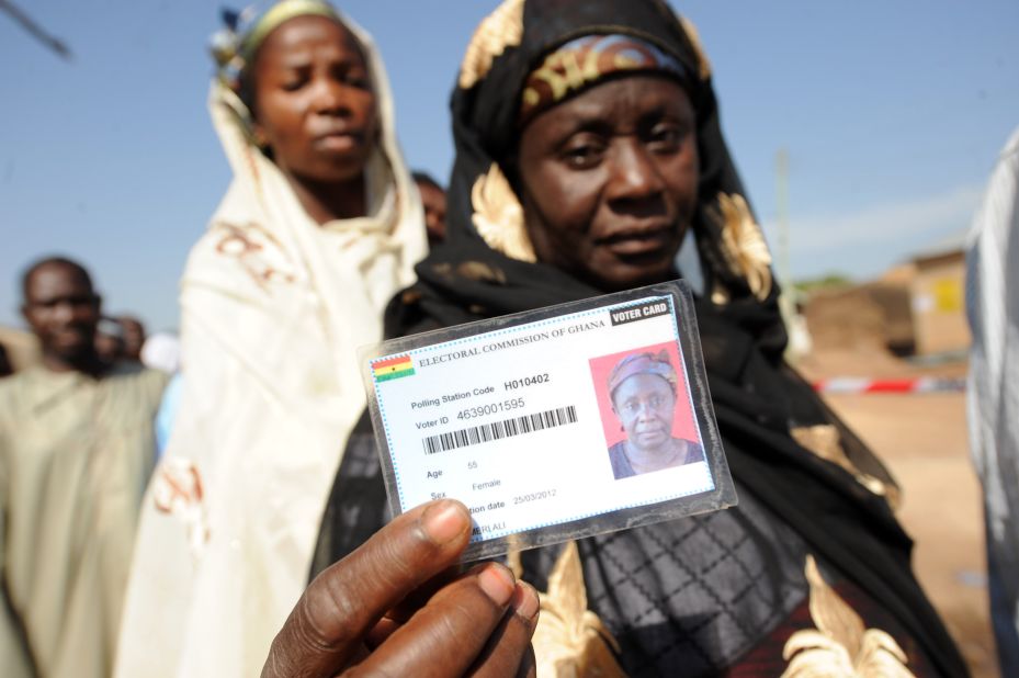 A woman shows her voter card prior to vote at Bole polling station on December 7, 2012.