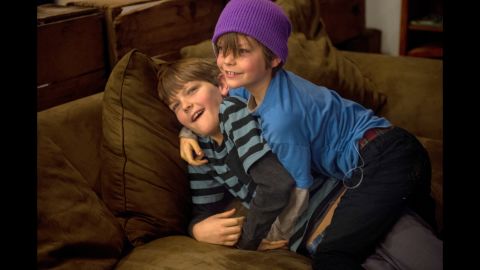 Cohen and Emmett wrestle with each other at home. Older brother Cohen, 10, is capable of monitoring his own glucose levels and counting his own carbohydrates, but he sometimes forgets. Both boys have emergency diabetes kits in their classrooms at school.