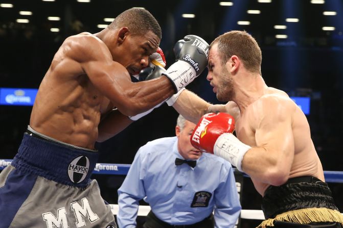 Pictured, Jacobs winning his world Middleweight crown against Jarrod Fletcher, in August 2014. Rozier never doubted that Jacobs would become world champion. "His battle with cancer was truly the hardest battle he could ever face. Everything else was a walk in the park," he said.<br />
