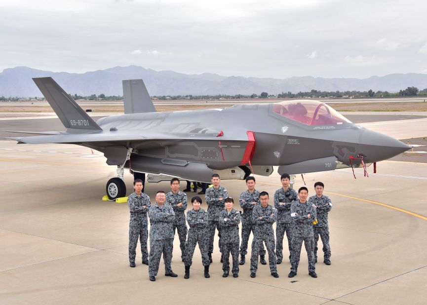 Japanese Air Self-Defense Force maintainers pose for a photo November 28, 2106, during the arrival of the first Japanese F-35A at Luke Air Force Base Arizona. The F-35 will give Japan a fifth-generation fighter.
