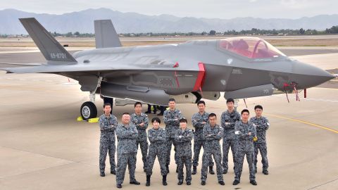 The Japanese Air Self-Defense Force maintainers pose for a photo during the arrival of the first Japanese F-35A at Luke Air Force Base, Arizona.
