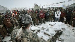 CANNON BALL, ND - DECEMBER 05:  Military veterans are briefed on cold-weather safety issues and their overall role at Oceti Sakowin Camp on the edge of the Standing Rock Sioux Reservation on December 5, 2016 outside Cannon Ball, North Dakota. Over the weekend a large group of military veterans joined native Americans and activists from around the country who have been at the camp for several months trying to halt the construction of the Dakota Access Pipeline. Yesterday the US Army Corps of Engineers announced that it will not grant an easement for the pipeline to cross under a lake on the Sioux Tribes Standing Rock reservation. The proposed 1,172-mile-long pipeline would transport oil from the North Dakota Bakken region through South Dakota, Iowa and into Illinois.  (Photo by Scott Olson/Getty Images)